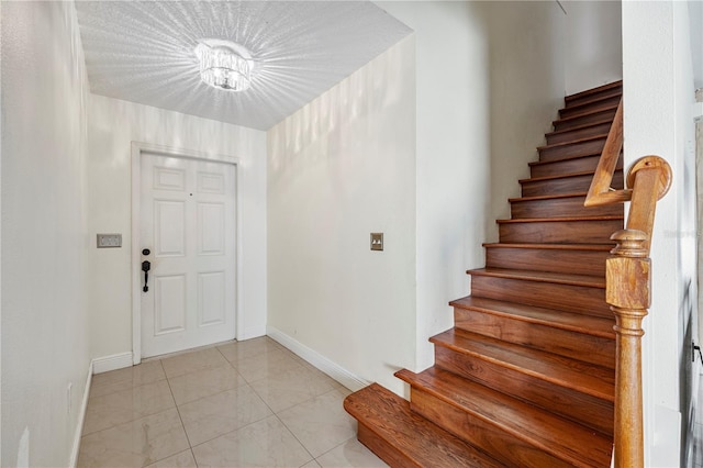 7819 Carriage Pointe Dr, Gibsonton, FL 33534 - foyer featuring stairs and baseboards
