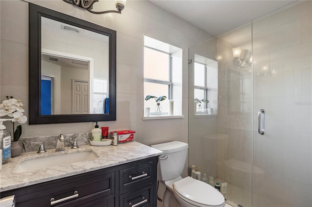 7819 Carriage Pointe Dr, Gibsonton, FL 33534 - full bathroom featuring vanity, a stall shower, and tile walls