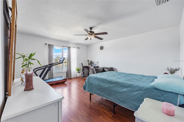7819 Carriage Pointe Dr, Gibsonton, FL 33534 - bedroom with wood finished floors, a textured ceiling, and a ceiling fan