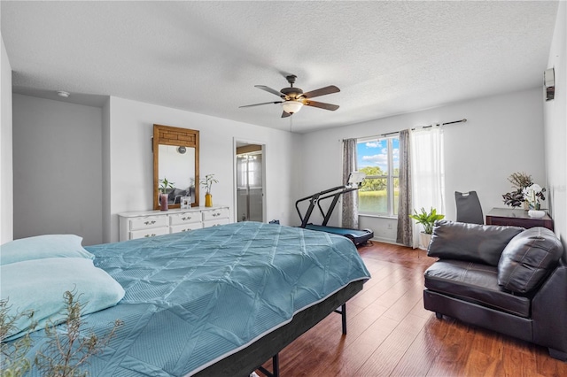 7819 Carriage Pointe Dr, Gibsonton, FL 33534 - bedroom featuring wood finished floors, a textured ceiling, and a ceiling fan