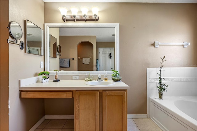 7819 Carriage Pointe Dr, Gibsonton, FL 33534 - bathroom with tile patterned flooring, a bath, and vanity