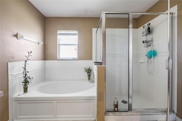 7819 Carriage Pointe Dr, Gibsonton, FL 33534 - bathroom with a garden tub and a shower stall