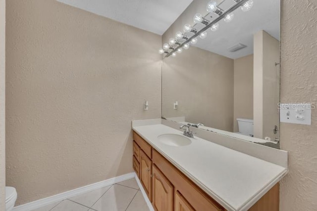 302 Old Mulrennan Rd, Valrico, FL 33594 - bathroom featuring vanity, a textured wall, and tile patterned floors