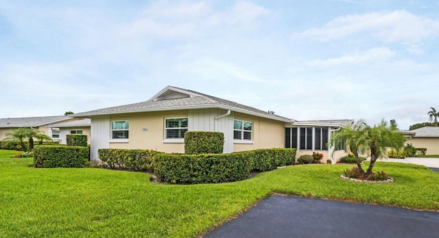 2814 Highlands Blvd Unit B, Palm Harbor, FL 34684 - view of home's exterior featuring a lawn