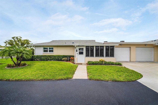2814 Highlands Blvd Unit B, Palm Harbor, FL 34684 - view of front of house featuring concrete driveway, an attached garage, a front yard, and stucco siding