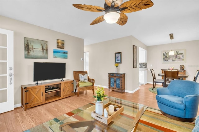 2814 Highlands Blvd Unit B, Palm Harbor, FL 34684 - living area with light wood-style flooring and a ceiling fan