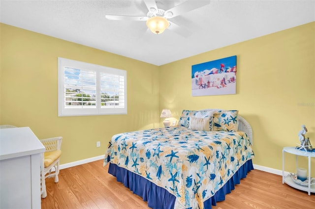 2814 Highlands Blvd Unit B, Palm Harbor, FL 34684 - bedroom featuring wood finished floors and a ceiling fan