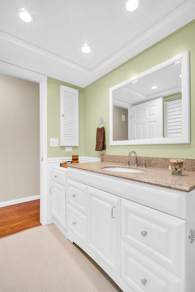 2814 Highlands Blvd Unit B, Palm Harbor, FL 34684 - bathroom featuring vanity, recessed lighting, a wainscoted wall, and wood finished floors
