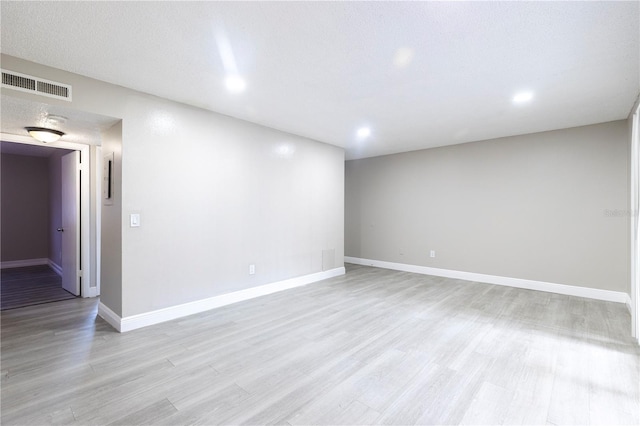 3805 Cortez Cir Unit B, Tampa, FL 33614 - empty room with light wood-style floors and recessed lighting