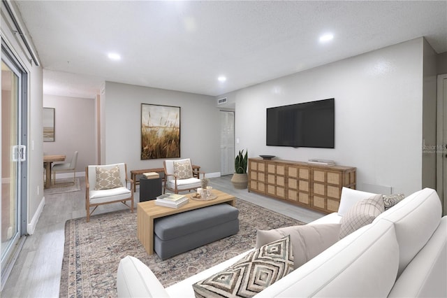 3805 Cortez Cir Unit B, Tampa, FL 33614 - living room with recessed lighting and light wood-style floors