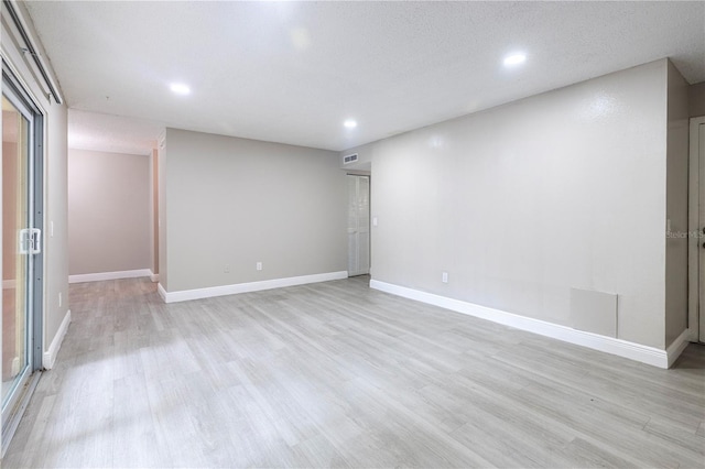 3805 Cortez Cir Unit B, Tampa, FL 33614 - spare room featuring recessed lighting, light wood finished floors, and a textured ceiling