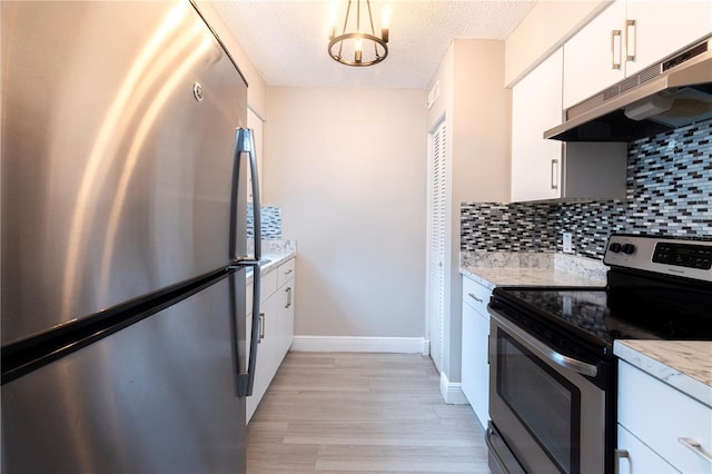 3805 Cortez Cir Unit B, Tampa, FL 33614 - kitchen featuring stainless steel appliances, under cabinet range hood, backsplash, light wood-style floors, and white cabinets