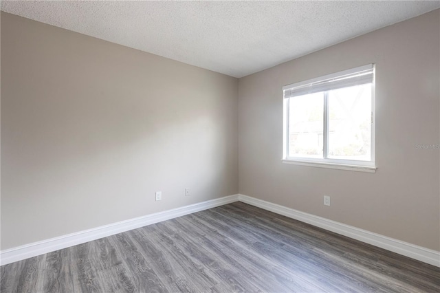 3805 Cortez Cir Unit B, Tampa, FL 33614 - empty room with wood finished floors and a textured ceiling