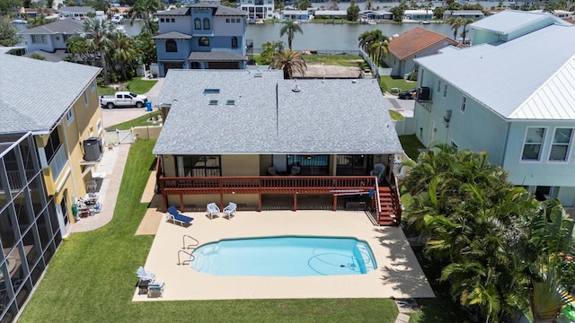 17025 Dolphin Dr, North Redington Beach, FL 33708 - swimming pool with a fenced backyard, a patio, a residential view, stairs, and a water view