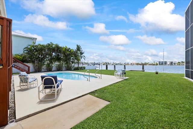 17025 Dolphin Dr, North Redington Beach, FL 33708 - view of swimming pool featuring a yard, a water view, a patio area, and stairway