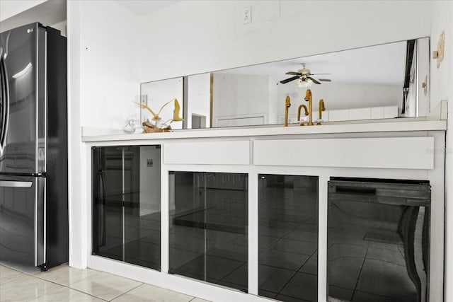 17025 Dolphin Dr, North Redington Beach, FL 33708 - detailed view of freestanding refrigerator and a ceiling fan