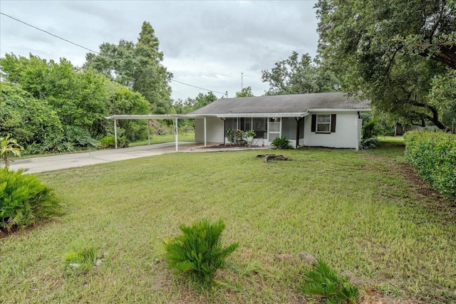 1400 E Fern Rd, Lakeland, FL 33801 - ranch-style home with concrete driveway, a front lawn, and a carport