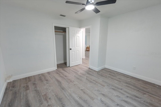 1400 E Fern Rd, Lakeland, FL 33801 - unfurnished bedroom with wood finished floors, a closet, and ceiling fan