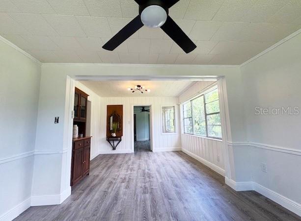 1400 E Fern Rd, Lakeland, FL 33801 - unfurnished room with ceiling fan, wood finished floors, and crown molding