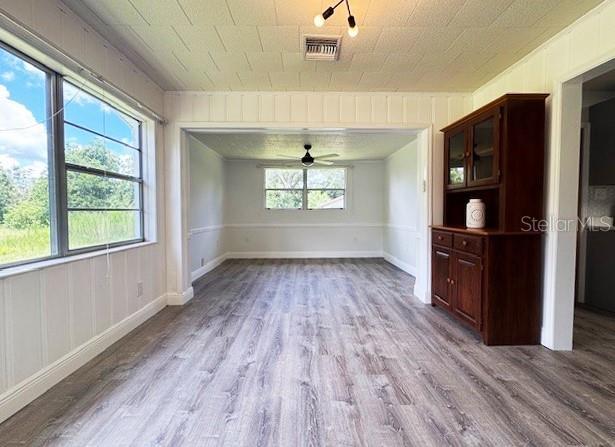 1400 E Fern Rd, Lakeland, FL 33801 - unfurnished dining area featuring wood finished floors and ceiling fan