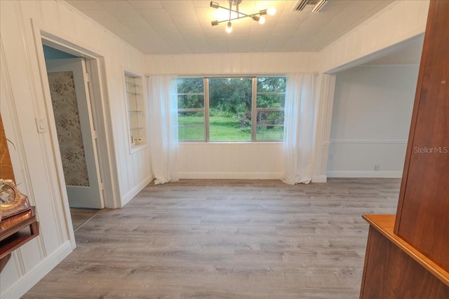 1400 E Fern Rd, Lakeland, FL 33801 - empty room with wood finished floors and built in features