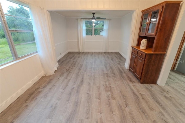 1400 E Fern Rd, Lakeland, FL 33801 - unfurnished dining area featuring light wood-style flooring and a ceiling fan