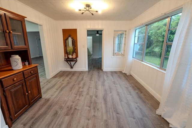 1400 E Fern Rd, Lakeland, FL 33801 - unfurnished dining area featuring light wood-style flooring and baseboards