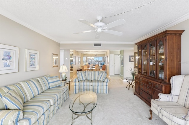 1 Key Capri Unit 302E, Treasure Island, FL 33706 - living area with ceiling fan, ornamental molding, light carpet, a textured ceiling, and a chandelier