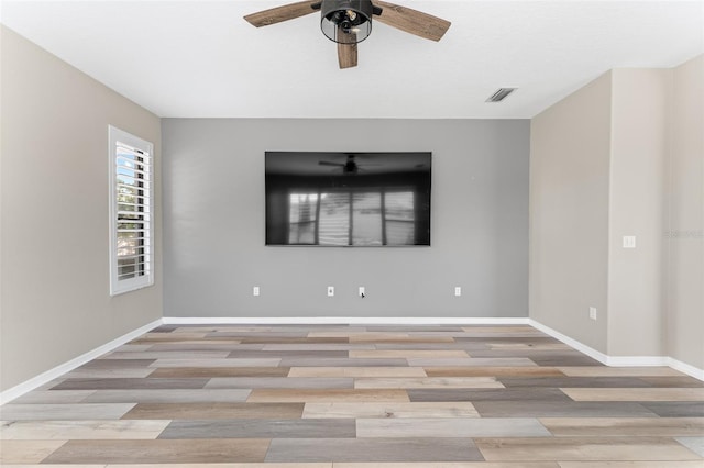1291 Blackrush Dr, Tarpon Springs, FL 34689 - spare room featuring a ceiling fan and light wood-type flooring