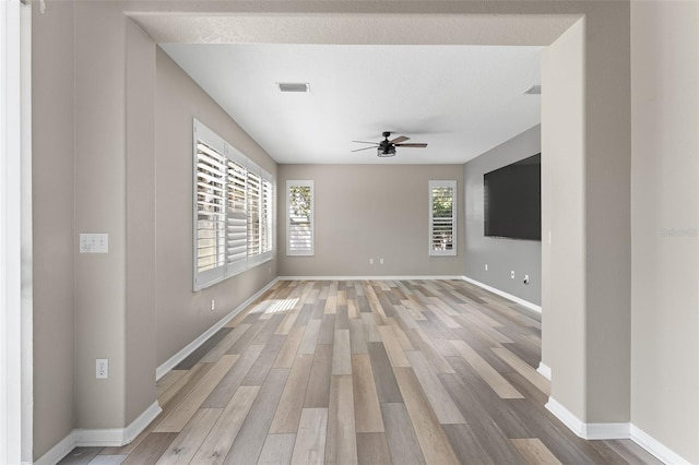 1291 Blackrush Dr, Tarpon Springs, FL 34689 - unfurnished room featuring ceiling fan and light wood-type flooring