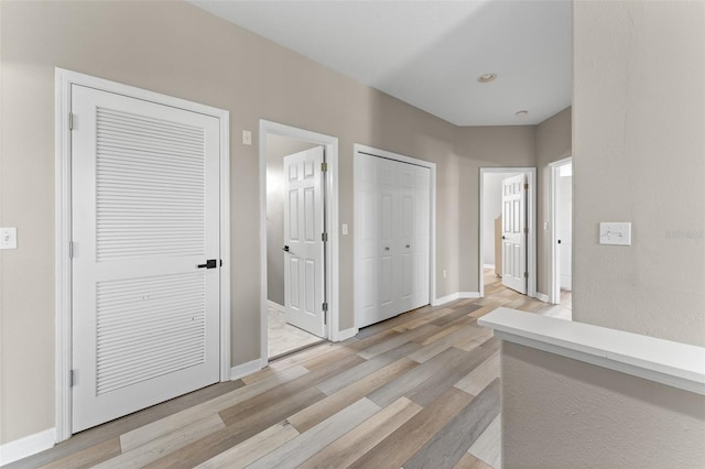 1291 Blackrush Dr, Tarpon Springs, FL 34689 - hall featuring light wood-style flooring