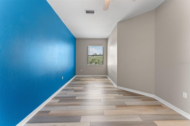 1291 Blackrush Dr, Tarpon Springs, FL 34689 - spare room featuring a ceiling fan and wood finished floors