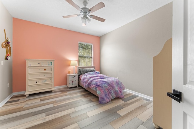 1291 Blackrush Dr, Tarpon Springs, FL 34689 - bedroom featuring wood finished floors and ceiling fan