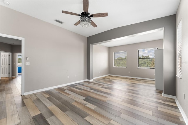 1291 Blackrush Dr, Tarpon Springs, FL 34689 - spare room with ceiling fan, light wood-type flooring, and a smoke detector