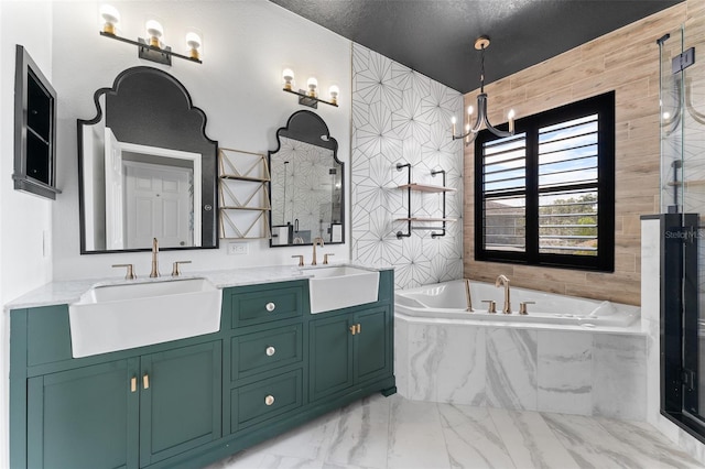 1291 Blackrush Dr, Tarpon Springs, FL 34689 - full bath with a garden tub, marble finish floors, double vanity, and a chandelier