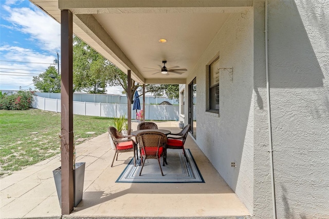 1291 Blackrush Dr, Tarpon Springs, FL 34689 - view of patio featuring ceiling fan and outdoor dining area