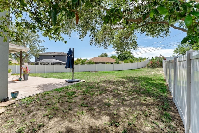 1291 Blackrush Dr, Tarpon Springs, FL 34689 - fenced backyard featuring a patio area