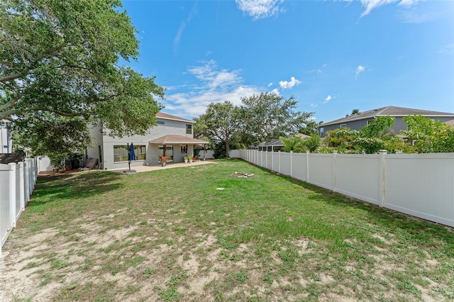 1291 Blackrush Dr, Tarpon Springs, FL 34689 - fenced backyard featuring a patio area