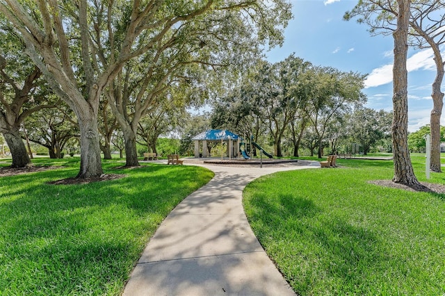 1291 Blackrush Dr, Tarpon Springs, FL 34689 - view of home's community with a lawn