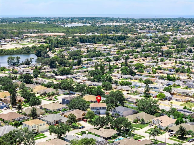 1291 Blackrush Dr, Tarpon Springs, FL 34689 - aerial perspective of suburban area with a nearby body of water