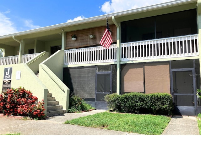 1865 Mazo Mnr Unit 1, Lutz, FL 33558 - view of building exterior featuring stairs