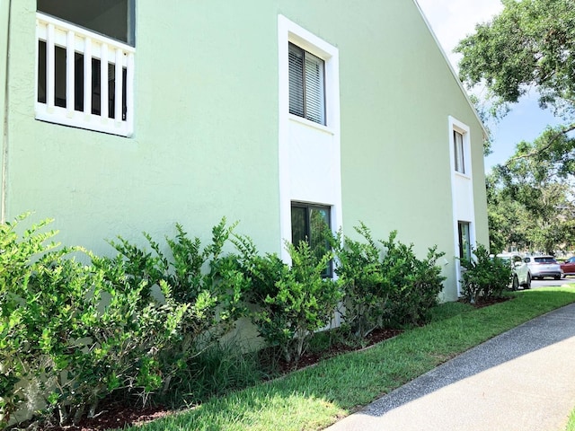 1865 Mazo Mnr Unit 1, Lutz, FL 33558 - view of property exterior with stucco siding