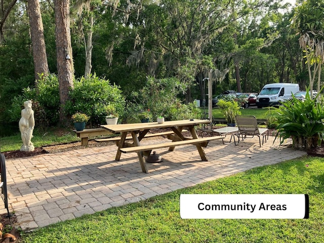 1865 Mazo Mnr Unit 1, Lutz, FL 33558 - view of patio with outdoor dining area