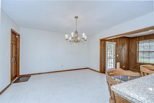 3125 S Miller Rd, Valrico, FL 33596 - dining room with a chandelier and wooden walls
