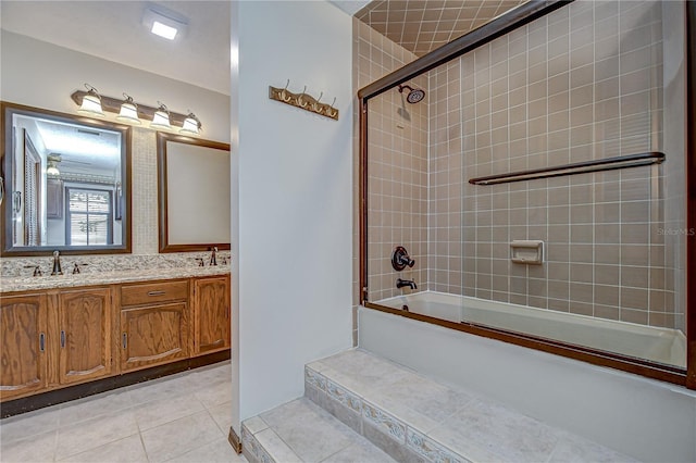 3125 S Miller Rd, Valrico, FL 33596 - bathroom featuring tile patterned flooring, bath / shower combo with glass door, and double vanity