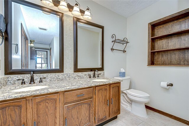 3125 S Miller Rd, Valrico, FL 33596 - full bath with double vanity, a textured ceiling, and tile patterned floors