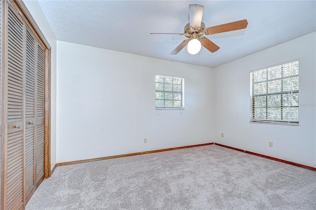 3125 S Miller Rd, Valrico, FL 33596 - unfurnished bedroom featuring carpet flooring, a closet, and ceiling fan