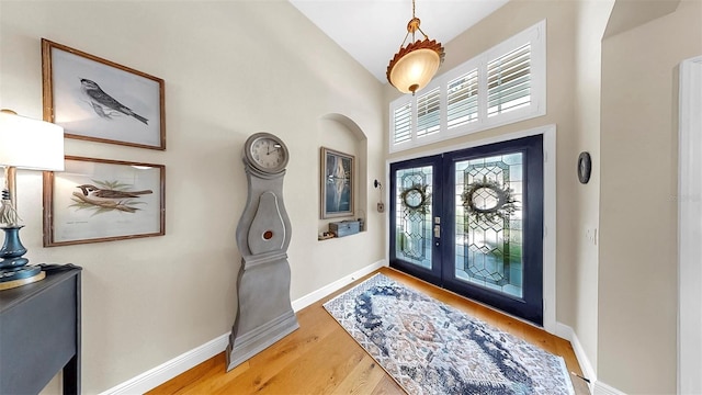 3506 Cordgrass Dr, Valrico, FL 33596 - foyer with light wood finished floors, a high ceiling, and arched walkways