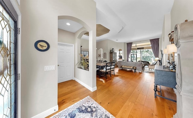3506 Cordgrass Dr, Valrico, FL 33596 - entrance foyer with arched walkways and light wood finished floors