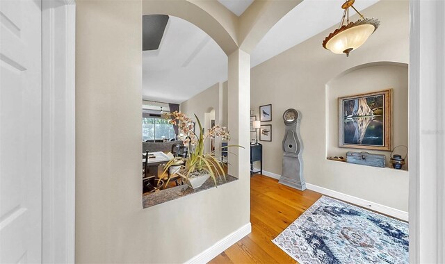 3506 Cordgrass Dr, Valrico, FL 33596 - foyer entrance with arched walkways and wood finished floors